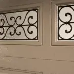 classic-steel-close-up-wrought-iron-window-desert-tan-garage-door