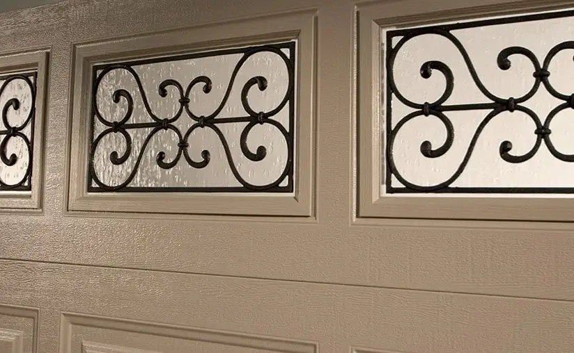 classic-steel-close-up-wrought-iron-window-desert-tan-garage-door